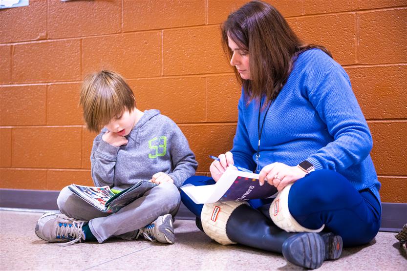 Students read to volunteers